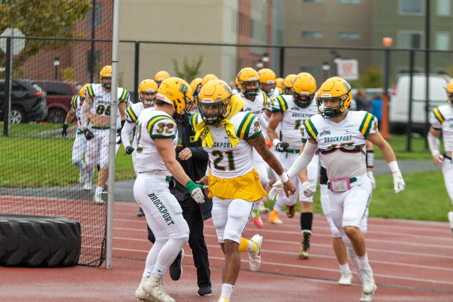 Brockport running onto the field to face Buffalo State