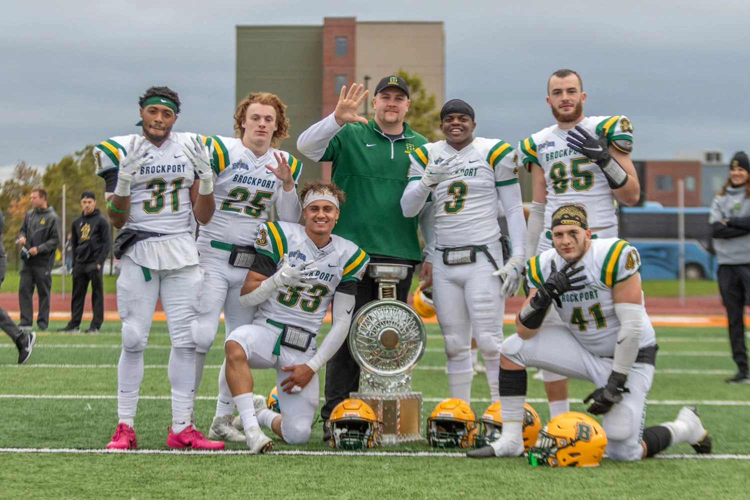 Brockport celerating after the win with the trophy
