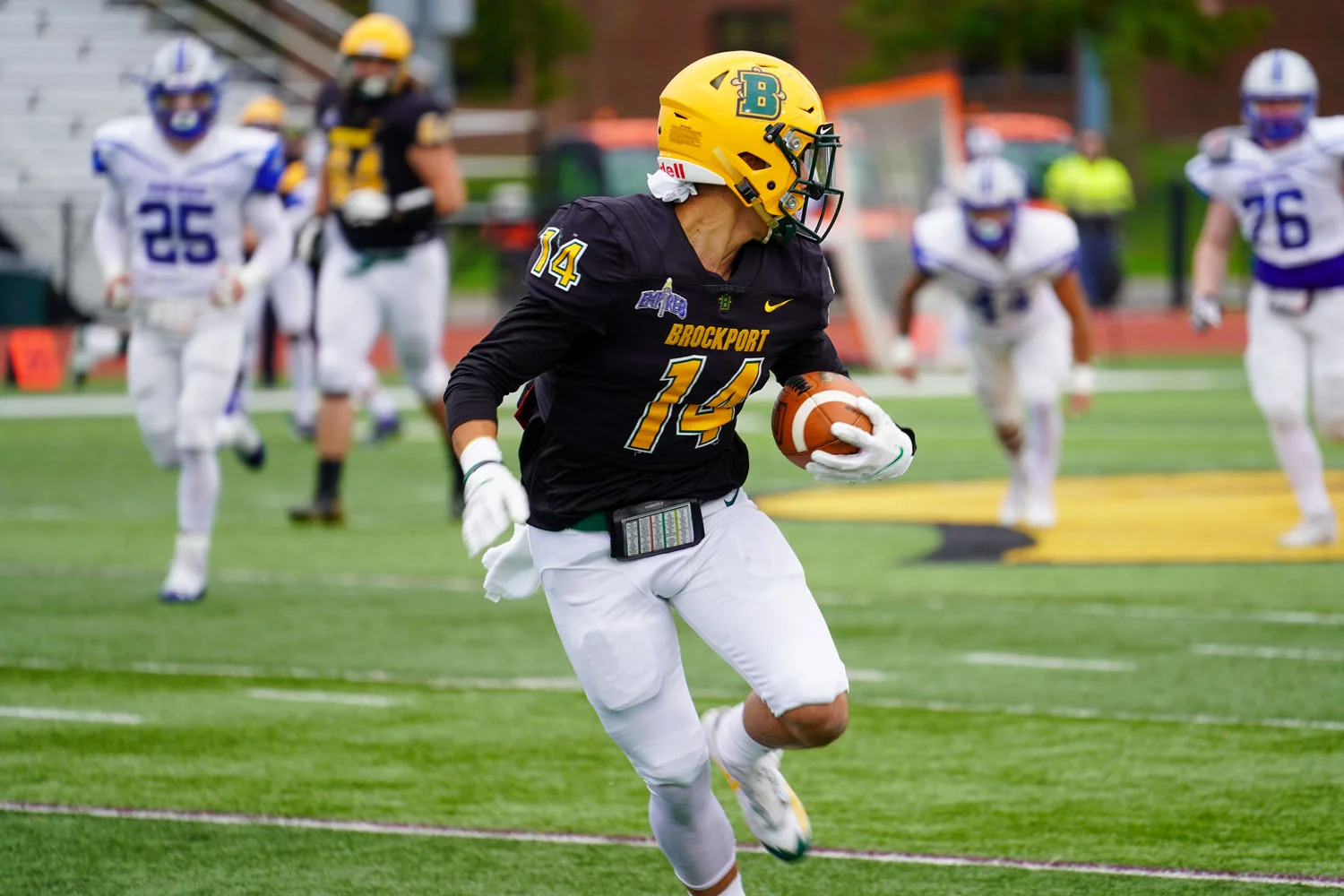 WR looking back to the defense while running down field