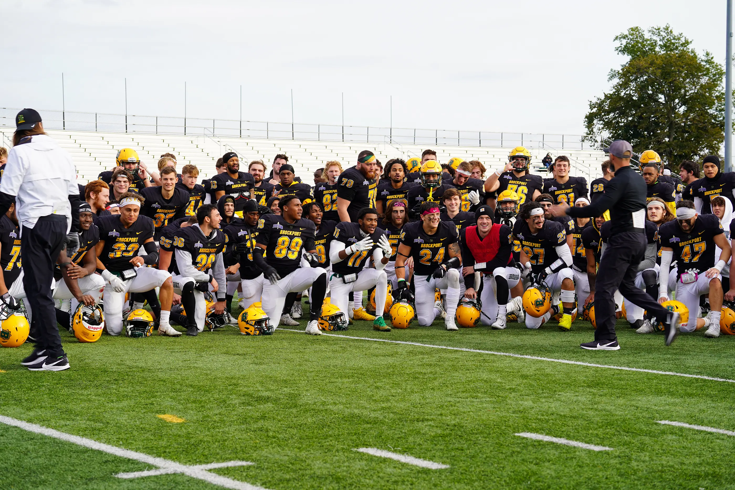 Brockport team huddle after the win against Hartwick