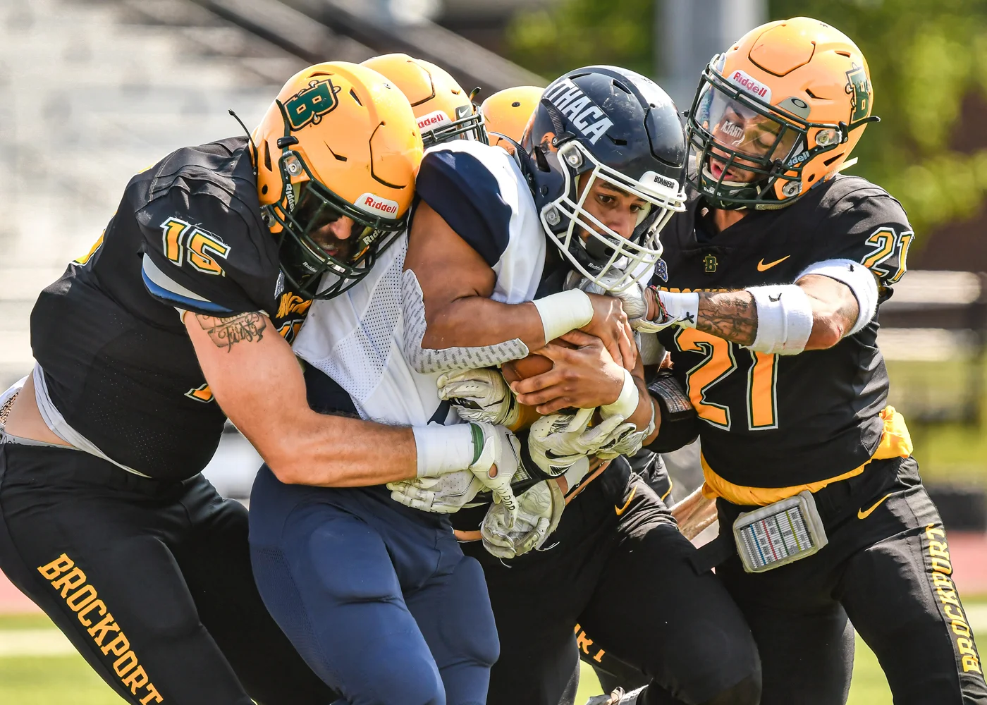 Brockport defenders tackle the Ithaca RB