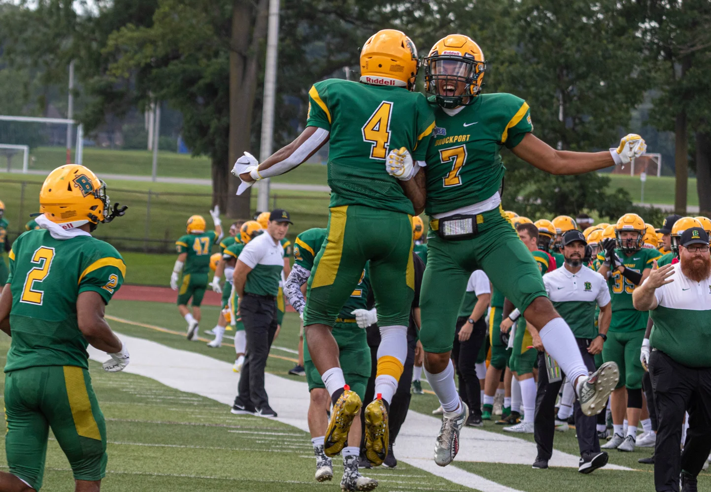 Brockport Offensive players celerating the touchdown