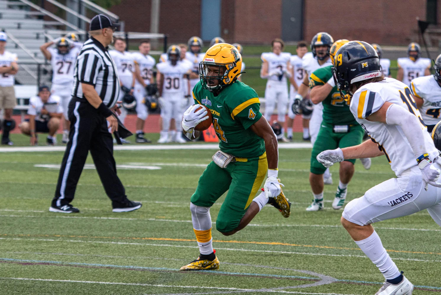 WR running down the field with the ball headed to the endzone