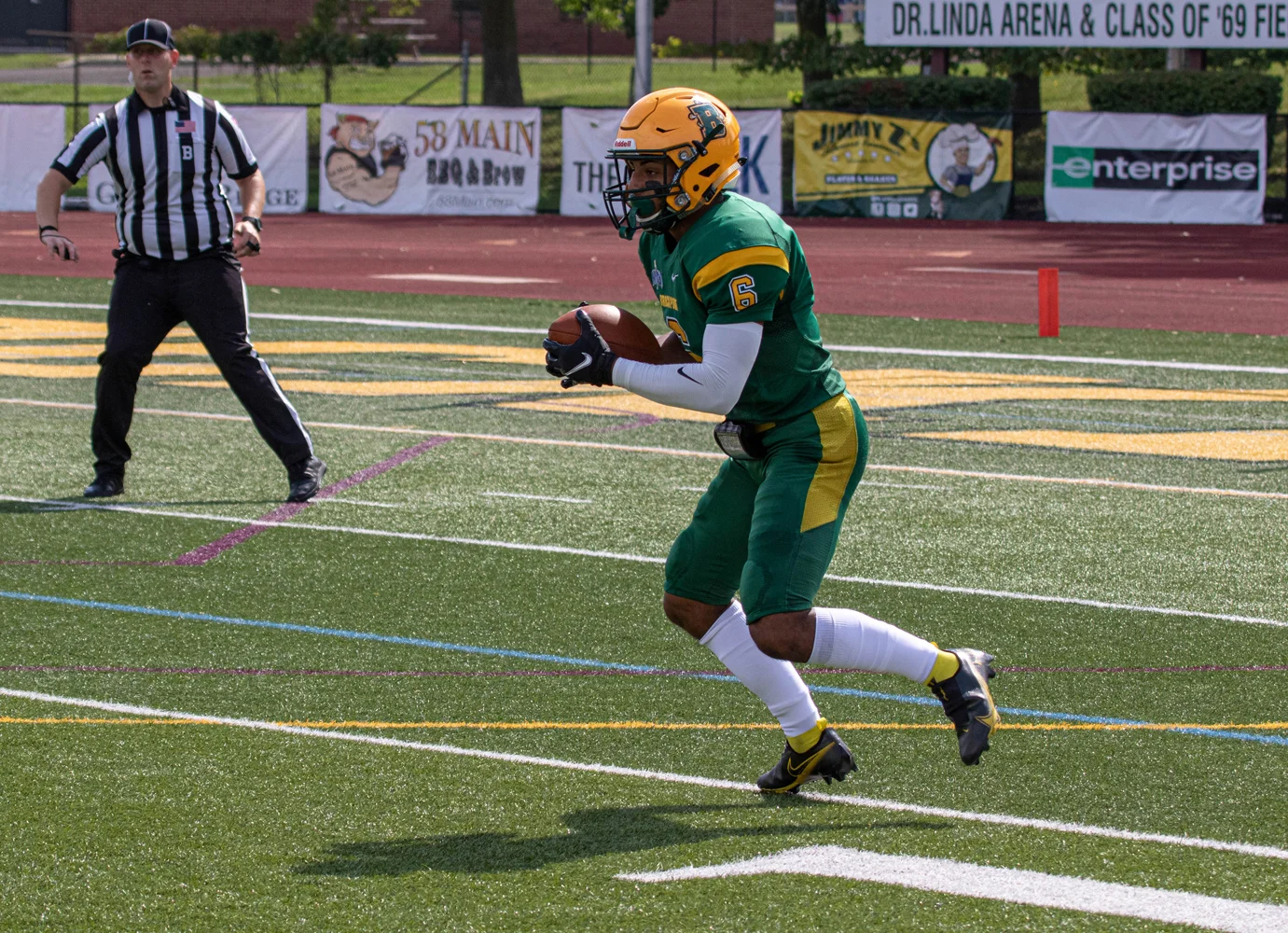 Brockport Punt Returner bringing the ball up the field