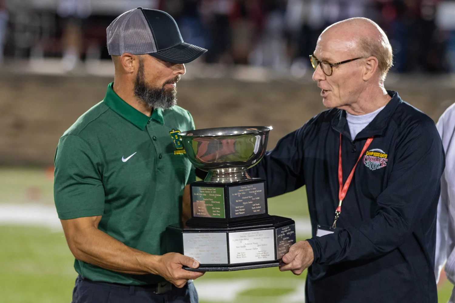 Coach Mangone getting the hardware for the Victory
