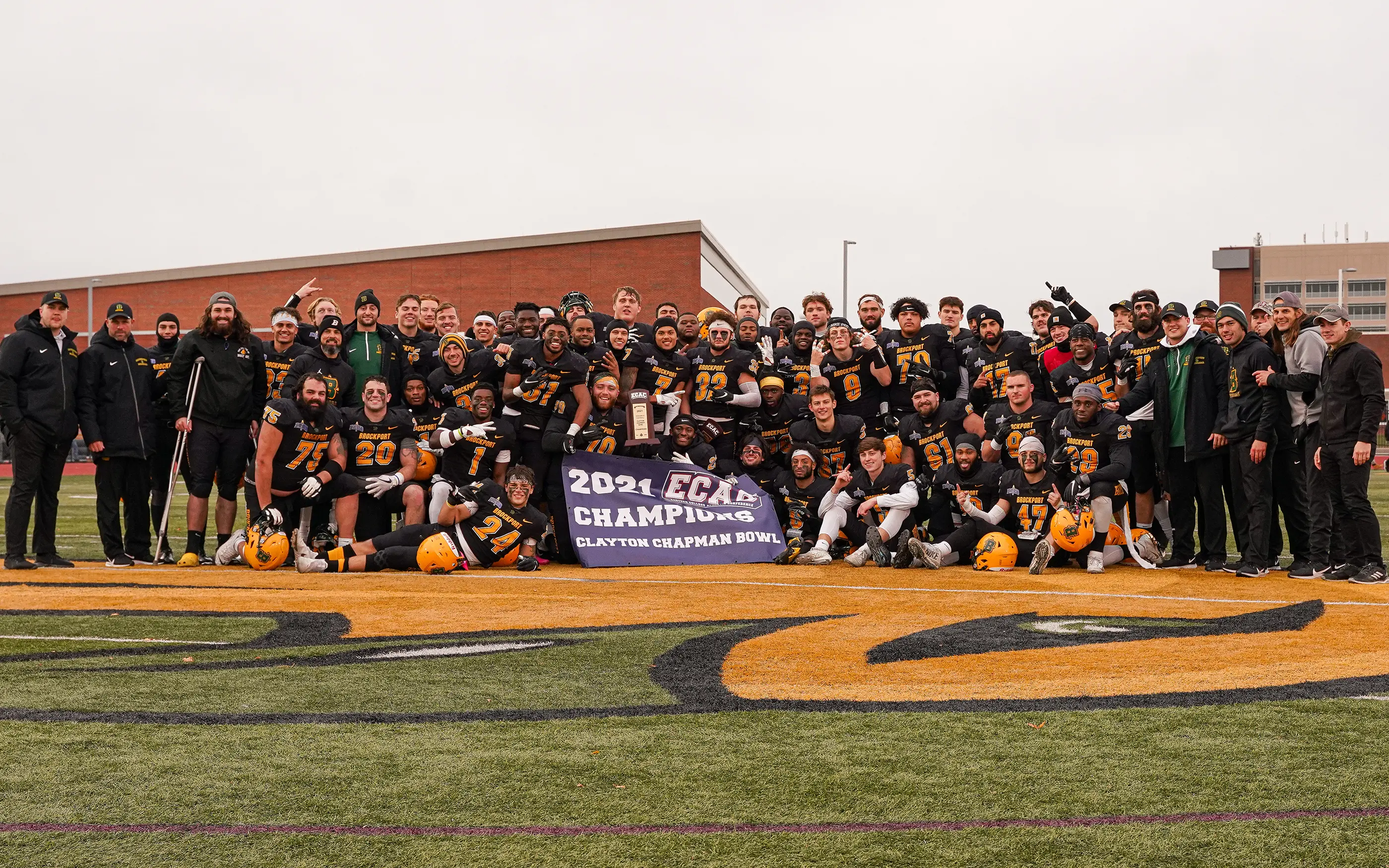 Brockport celerating after the win with the trophy