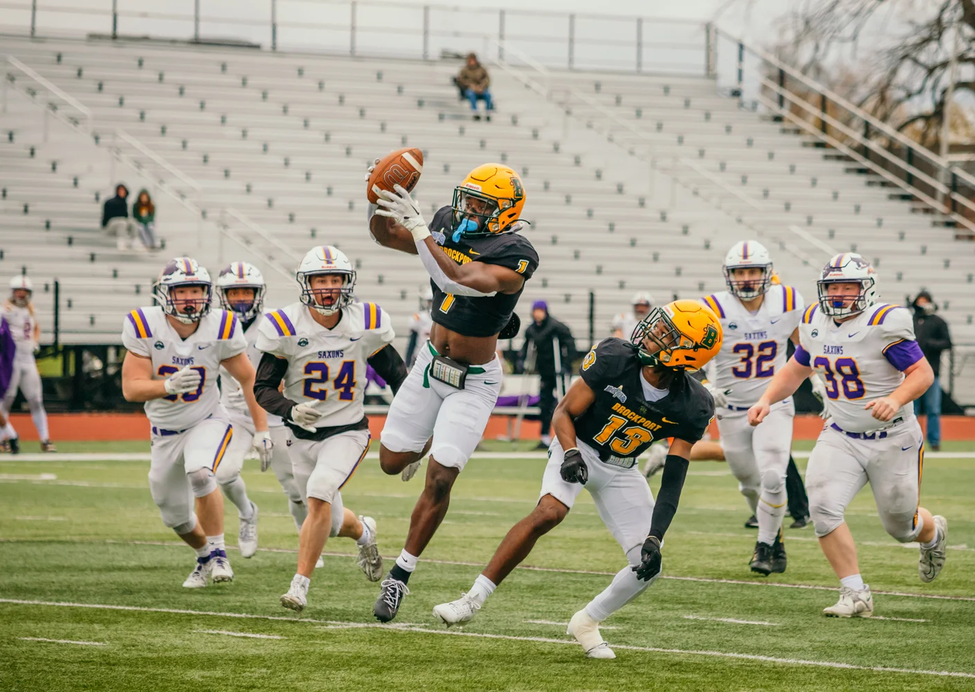 DB getting the ball and looking to the endzone