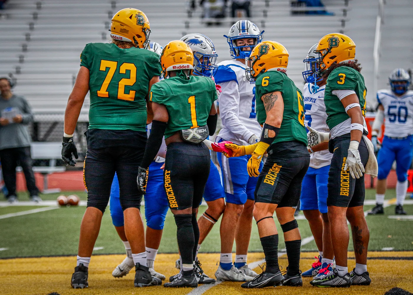 The captains meeting at midfield for the coin toss