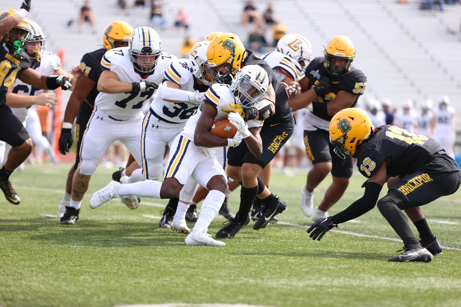 LB and teammates making the stop against the Lycoming RB