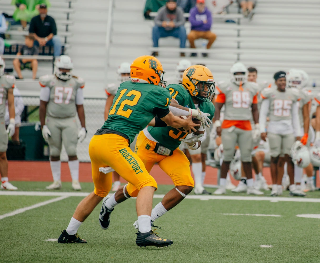 Brockport QB handing the ball off to the RB