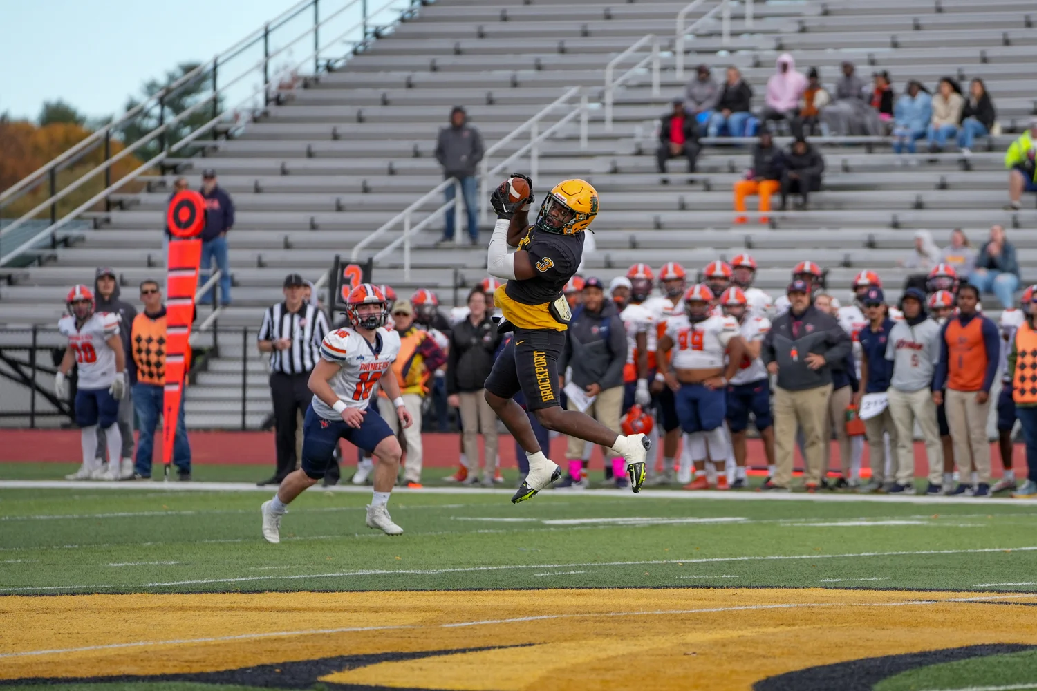 WR going up and making the catch near midfield
