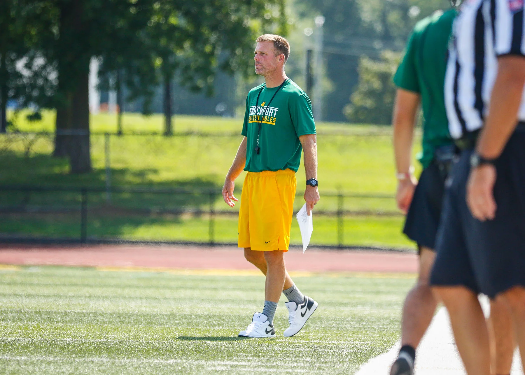 Coach Fox watching the play on the field