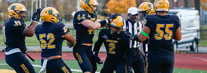 Brockport Golden Eagless Football Celebration in the endzone